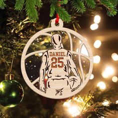 a basketball ornament hanging from a christmas tree