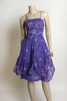 "FREE DOMESTIC SHIPPING! <3 ♥ Lovely vintage 1970s purple floral print, sheer sundress! ♥ Zips in the back. ♥ Fitted waist, with a double layered, sheer overlay skirt. Square angle cut give it a unique look, and great twirls! ♥ Spaghetti straps! Such a pretty floral print! ♥ In great condition! Light lavender purple polyester. Montgomery Ward tag. * measurements when flat * Armpit to armpit - 15\" across Waist - 12\" across Hips - 20\" across Bodice length - 17\" Length - 41\" Fits like a sma Retro Purple Dress For Spring, Spring Floral Print Purple Sundress, Retro Purple Spring Dress, Purple Retro Spring Dress, Purple Dress Aesthetic, Retro Purple Sleeveless Dress, Purple Retro Sleeveless Dress, Vintage Purple Mini Dress, Fitted 1970s Style Purple Dress