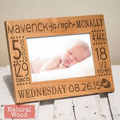 a wooden frame with a baby's birth date on it