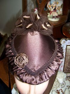 "You are purchasing a Victorian ladies Civil War Hat or purse also great for Civil War reenactors or Dickens's Christmas events. The Hat measures 9\" front-back 8\" side to side and 5\" tall with puff in the back. The hat is trimmed with black satin and braid. The ribbons are black satin and the Bow in the back is black tulle with black satin ribbon mixed in. The fabric is satin and it is fully lined. The embellishment on the front is black satin ribbon rose. I can make this item in many other f Missions Conference, Victorian Dress Gown, Rose Costume, Diy Hats, Satin Ribbon Roses, Victorian Hats, Victorian Ladies, Antique Hats, Victorian Costume