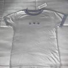 100% Cotton Brand New With Tags White And Light Blue Crew Neck Casual Blue T-shirt With Heart Graphic, Casual White Tops With Heart Graphic, Casual White Top With Heart Graphic, Blue Tops With Heart Print For Spring, Blue Heart Print Tops For Spring, Spring Blue Heart Print Tops, Blue Heart Print Top For Summer, Cute Blue Cotton Shirt, Blue Summer Top With Heart Graphic