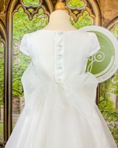 Made in Spain Dry Clean 100% polyester Final sale, no exchanges nor returns will be accepted after purchase Fitted Bow Dress For First Communion, Elegant Baptism Dress With Lace Back, Fitted Dress With Bow For Confirmation, Elegant Lace Back Baptism Dress, Elegant Lace Back Dress For Baptism, Confirmation Dresses With Lace Back, Lace Dress With Fitted Bodice For First Communion, Fitted Lace Back Dress For Confirmation, White Tulle First Communion Dress With Bow