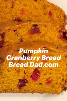 two slices of pumpkin cranberry bread on a white plate with text overlay