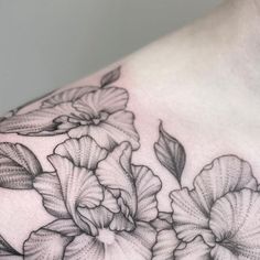 a woman's chest with flowers on it