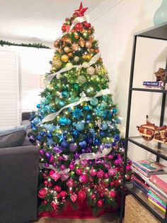 a brightly colored christmas tree in a living room