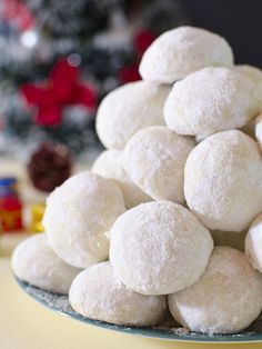 coconut snowball cookies stacked on top of each other