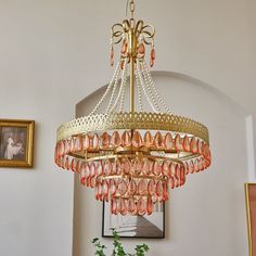 a chandelier hanging from the ceiling in a room