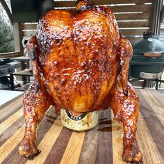 a whole chicken sitting on top of a wooden table