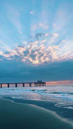 Golden sunrise over Surfside Beach pier with soft waves and clouds illuminated by morning light creating a serene coastal view Peaceful Sunrise, Peaceful Moments, The Ocean, In This Moment