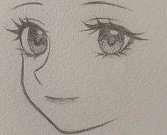 a drawing of a woman's face with long lashes and big eyes is shown