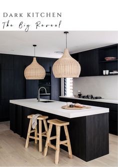 an image of a kitchen setting with black cabinets and white counter tops, two stools in front of the island