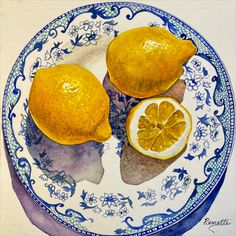 a painting of two lemons on a blue and white plate