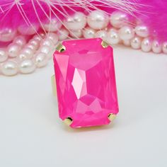 🎀 Introducing our dazzling Neon Pink premium Rectangle Crystal Statement Rings! 🎀 Looking for that perfect pop of color? Look no further than our BRAND NEW crystal creation -Neon Pink! 💖 This Hot Pink Cocktail Ring is not just a piece of jewelry; it's a statement. Crafted with precision, this Large Crystal Ring boasts a big, bold gem measuring 27 X 18.5 mm, exuding an irresistible sparkle and radiance. Set against a shiny gold-plated four-prong adjustable and comfortable band, it's a true Bar Pink Cocktail Ring, Hot Pink Cocktails, Cocktail Rose, Bridal Jewellry, Rectangle Ring, Big Stone Ring, Pink Cocktails, Pink Cocktail, Ring Men