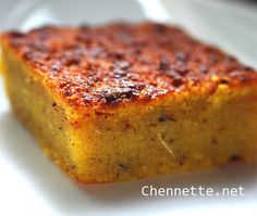 a square piece of cake on a white plate