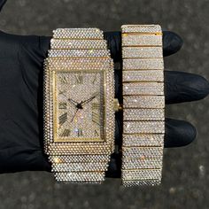 Step into elegance with this fully iced-out diamond watch and bracelet set, that mirrors genuine luxury watches. We utilize premium simulated diamonds crafted from high-refractive crystals, ensuring a sparkle that rivals authentic diamonds under the light! INCLUDES AN EASY-TO-USE SIZE ADJUSTMENT TOOL Specifications: - Gender: Men's - Case Size: 40mm - Sizing: 8.5-inch band - Bracelet Length: 9-inches (Non-adjustable) - Movement: Quartz Movement - Battery: Included - Adjustable: Watch Links are r Gold Diamond Watch With Bling, Gold Diamond Watch With Cubic Zirconia Bling, Gold Embellished Cubic Zirconia Diamond Watch, Gold Diamond Watch With Rhinestones And Cubic Zirconia, Iced Out Diamond Jewelry And Watches For Gifts, Gold Diamond Watch Iced Out, Luxury Iced Out Diamond Watch In Stainless Steel, Luxury Iced Out Stainless Steel Diamond Watch, Watch And Bracelet Set