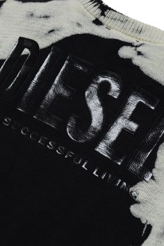 a black and white tie dye t - shirt with the word f & f on it