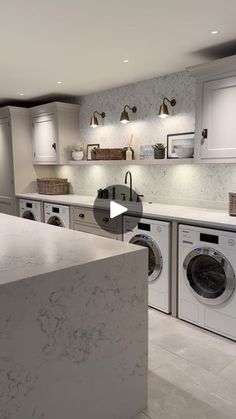 an image of a kitchen setting with washer and dryer in the foreground