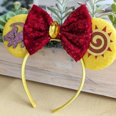 a close up of a minnie mouse ears headband with sequins on it