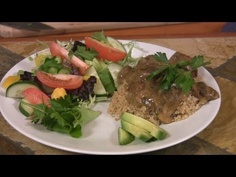 a white plate topped with meat and veggies