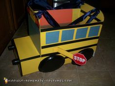 a cardboard school bus with a stop sign on it