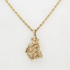 Make a statement with this captivating handmade nugget in 14k gold. The nugget weighs 10.8 grams and measures 26mm x 22mm. Chain sold seperately. The Nugget, Nugget Necklace, Necklace Charm, Pendant Necklaces, Charm Necklace, Jewelry Necklace Pendant, Beauty Book, Accessory Gift, Jewelry Necklaces