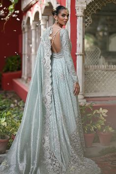 Adhira – Sania Maskatiya International Designer Light Blue Dress With Chikankari Embroidery, Designer Light Blue Chikankari Embroidery Dress, Silver Anarkali Set In Raw Silk, Anarkali Silver Raw Silk Set, Anarkali Style Silver Raw Silk Set, Silver Raw Silk Set For Wedding, Silver Raw Silk Wedding Set, Elegant Light Blue Floor-length Sets, Traditional Silver Gown For Designer Wear