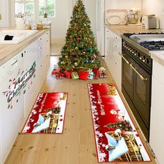 a christmas tree in the middle of a kitchen with red place mats on the floor