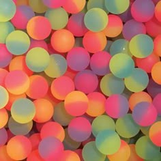 a bunch of balls that are all different colors in the same pattern and size, as well as some sort of color