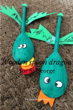 wooden spoon dragon for st george's day on the carpet with arrows pointing to each other