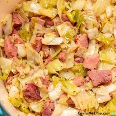 cabbage and meat in a pot on the stove