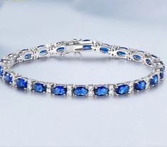 Introducing our stunning Tennis Bracelet with Sapphires, a true testament to elegance and sophistication. Crafted from high-quality 925 sterling silver, this exquisite piece features genuine sapphires (lab grown) and sparkling cubic zirconia that enhance its beauty. Measuring approximately 18 cm in length, it comfortably fits most wrists, making it a perfect addition to any jewelry collection. This Tennis Bracelet is designed for those unforgettable moments, whether you're dressing up for a wedding, a birthday celebration, or simply wanting to add a touch of luxury to your everyday attire. The combination of vibrant blue sapphires and radiant zirconia stones creates a stunning visual appeal, making it an ideal jewelry piece that catches the eye and complements any outfit. Additionally our Elegant Silver Tennis Bracelet With Sapphire, Elegant Silver Sapphire Tennis Bracelet, Sapphire White Gold Tennis Bracelet As A Gift, White Gold Sapphire Tennis Bracelet As Gift, Elegant Sapphire Sterling Silver Bracelet As Gift, Anniversary White Gold Sapphire Tennis Bracelet, Bracelet For Wedding, Wedding Jewelry Bracelets, Sapphire Bracelet