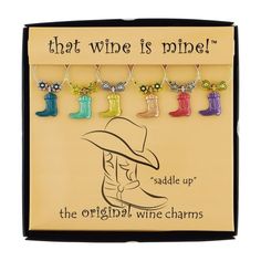 the original wine charms have been made to look like cowboy boots and are hanging on a string