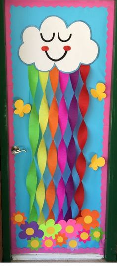 a door decorated with colorful paper and clouds