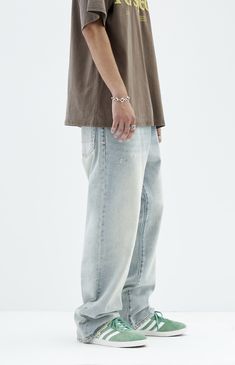 Experience laid-back comfort with PacSun's Light Tinted Indigo Baggy Jeans. These jeans feature a lived-in feel with a zip fly closure and a tinted indigo wash. Crafted from rigid cotton, they offer a wide leg and a five-pocket body, combining durability with casual style for everyday wear.


	Model is wearing size 32
	Model Measurements: 6'0” Height, 28” Waist, 32” Inseam Light Wash Zip Fly Bottoms For Streetwear, Light Wash Zip Fly Jeans For Streetwear, Urban Jeans With Relaxed Fit And Zip Fly, Casual Denim Blue Jeans With Zip Fly, Baggy Cotton Jeans With Zip Fly, Casual Faded Tapered Leg Bottoms, Casual Straight Leg Bottoms With Zip Fly, Casual Faded Bottoms With Five Pockets, Casual Jeans With Zip Fly For Spring