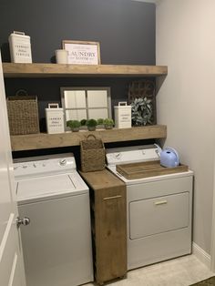 a washer and dryer sitting in a room next to each other on shelves