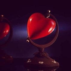 two heart shaped objects sitting on top of each other