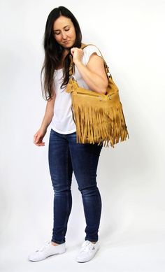 LEATHER FRINGE - leather boho fringe handbag.This hobo is the perfect size to carry your daily essentials in style! It is made from high quality leather.This leather bag can be used as a tote and messenger bag. By using the adjustable leather strap you can convert it into a crossbody bag.This leather bag is a perfect everyday bag! There is a lot of space and you can put there everything in your everyday life.* Lining* An external pocket on the back* Includes internal pockets for mobile phone and Travel Fringe Hobo Shoulder Bag, Travel Hobo Shoulder Bag With Fringe, Fringe Hobo Shoulder Bag For Everyday Use, Bohemian Crossbody Satchel With Fringe, Everyday Fringe Hobo Shoulder Bag, Everyday Bohemian Shoulder Bag With Tassels, Bohemian Fringe Crossbody Satchel, Everyday Fringe Rectangular Hobo Bag, Fall Fringe Satchel Bag