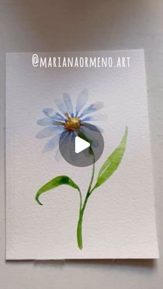 a card with a blue flower on it