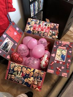 a box filled with lots of pink balloons next to pictures and hearts on the wall