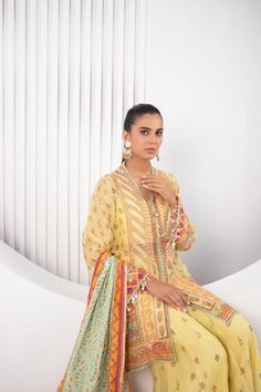 All in the details; this gorgeous festive silhouette is cut from pure cotton net in a refreshing lemon hue is detailed with gota and zardoze work with tiny tassel details on the sleeves and neckline. This short kurta and and dhaka pajama set is paired with a printed silk dupatta with gota and dhanak details. Dhaka Pajama, Sania Maskatiya, Kurta With Dupatta, Short Kurta, Desi Style, Silk Dupatta, Printed Silk, Signature Collection, Sleeve Designs