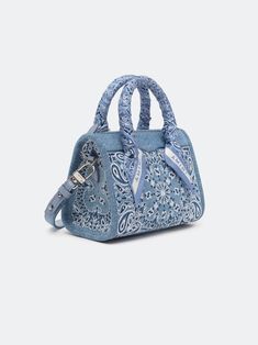 House signature motifs adorn iconic forms in new, seasonal fabrications for Pre-Fall 2024. The denim Bandana Micro Triangle Bag is embroidered with the house's bandana paisley and features top handles with tied paisley scarf accents and a detachable denim shoulder strap. PRE-FALL 2024 COLLECTION MADE IN ITALY 100% COTTON Ch Matryoshka Bag, Bandana Purse, Denim Bandana, Paisley Scarf, Triangle Bag, Paisley Scarves, Vintage Jerseys, Crossbody Tote Bag, New Sneakers