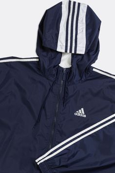 Sourced in Canada MeasurementsSize: XLPit to Pit: 26"Arm: 25"Length: 31.5"Condition: Visible logo wear, good vintage conditionMaterial Composition: 100% NylonColour: Navy Sporty Nylon Outerwear With Three Stripes, Sporty Nylon Outerwear With Stripes, Casual Adidas Nylon Windbreaker, Adidas Nylon Track Jacket For Outdoor, Long Sleeve Nylon Outerwear With Three Stripes, Adidas Nylon Sportswear Outerwear, Sporty Navy Windbreaker With Double-lined Hood, Navy Nylon Track Jacket For Streetwear, Functional Adidas Windbreaker With Long Sleeves