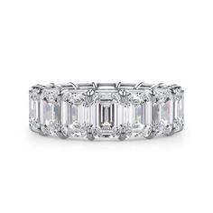 an emerald cut diamond ring with baguetts in the center and side stones on each band