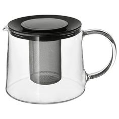 a glass tea pot with a black lid