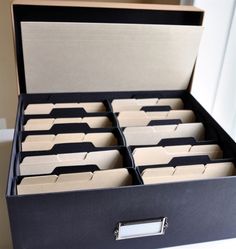 an open file cabinet filled with files and folders