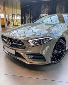 the front end of a silver mercedes cla