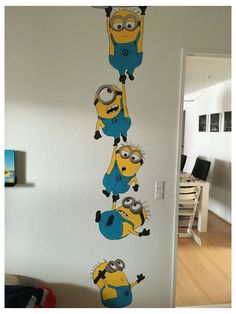 this is an image of a wall sticker in the shape of minion characters