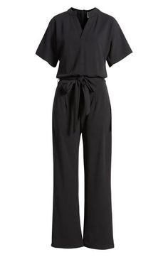 A sash cinches the waist of this comfortable stretch-enriched jumpsuit framed by short sleeves and a collared V-neckline. Mandarin collar V-neck Short sleeves Removable sash 90% polyester, 10% spandex Dry clean Made in the USA Chic Belted Jumpsuits And Rompers With Short Sleeves, Chic Belted Short Sleeve Jumpsuits And Rompers, Chic Belted Jumpsuit With Short Sleeves, Chic Belted Short Sleeve Jumpsuit, Elegant Black Short Sleeve Jumpsuits And Rompers, Chic Short Sleeve Jumpsuits And Rompers For Workwear, Chic Black Short Sleeve Jumpsuits And Rompers, Black Tie Waist Jumpsuit For Work, Short Sleeve Belted Jumpsuits And Rompers For Work