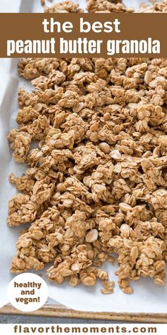 granola on a baking sheet with text overlay that says the best peanut butter granola