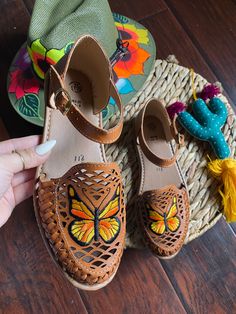 Our huaraches are proudly handmade by Mexican Artisans using genuine leather, vegetable-based dyes, and recycled rubber soles. The genuine leather huaraches will stretch and mold to your feet. Becoming softer every time you wear them and will provide durability and comfort.  PLEASE READ BEFORE ORDERING:   * If you wear a half-size shoe (ex: 7.5), please order a half-size UP (ex: 8)  * if your feet are wide please size up. * Natural leather may reflect blemishes, and it takes a few uses for your Artisan Closed Toe Huaraches For Spring, Artisan Brown Hand Tooled Huaraches, Artisan Hand-tooled Brown Huaraches, Artisan Brown Hand-tooled Huaraches, Multicolor Handmade Huaraches For Festival, Festival Multicolor Handmade Huaraches, Handmade Multicolor Festival Huaraches, Adjustable Brown Flat Huarache Sandals, Brown Hand Tooled Summer Huaraches